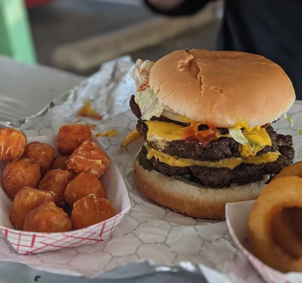 Double Bacon Cheeseburger with Onion Rings and Sweet Potato Tots